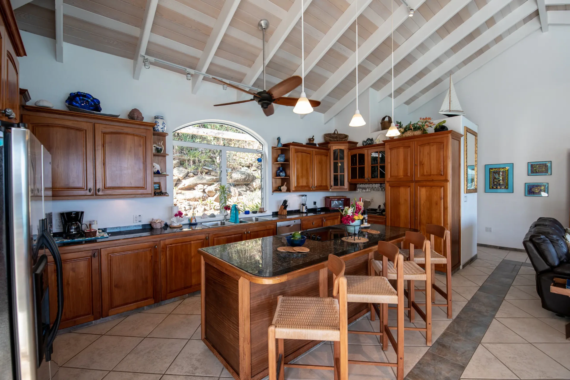 Chef's kitchen with mahogany cabinetry and breakfast bar