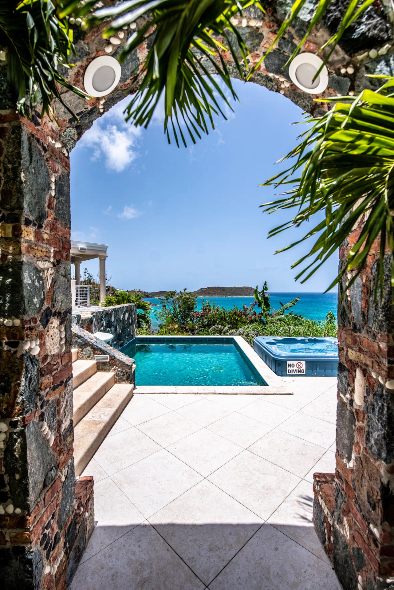 Sanctuary villa pool deck at sunset above Rendezvous Bay, St. John